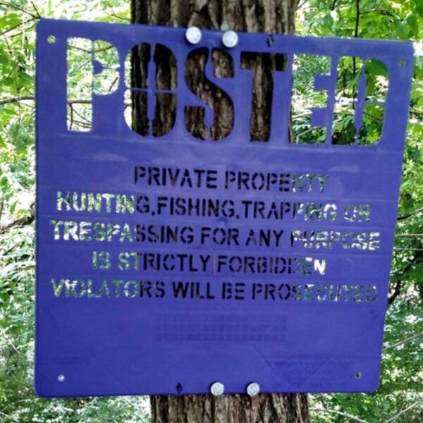 Purple Extra Durable Polymer Sign on a Tree