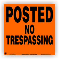 orange posted no trespassing sign metal