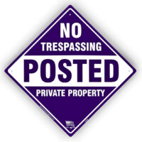purple posted no trespassing sign